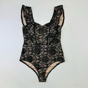 Tea & Cup NWT black lace nude bodysuit Fits Medium ruffles
Romantic